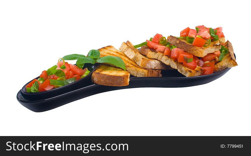 Delicous plate of bruschetta isolated over white background. Delicous plate of bruschetta isolated over white background