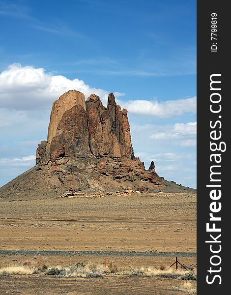 A lone mountain or butte in the Utah desert, actually in grazing grounds, though it looks very dry. A lone mountain or butte in the Utah desert, actually in grazing grounds, though it looks very dry