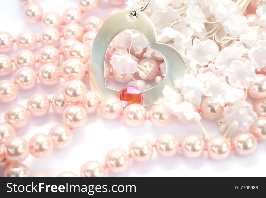 Necklace with heart and pink stone on it,pink pearls and white fabric flowers. Necklace with heart and pink stone on it,pink pearls and white fabric flowers.