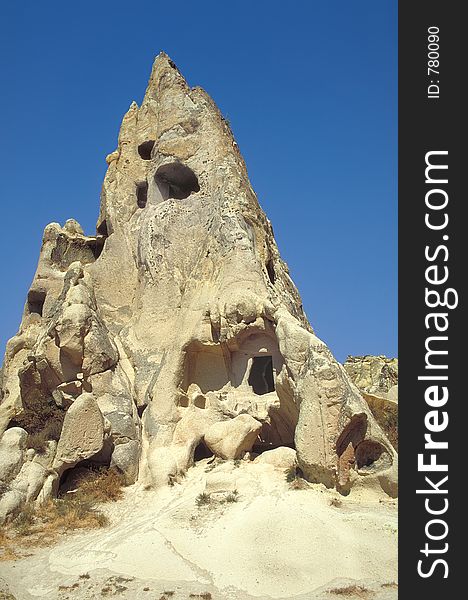 Ancient houses digged in the tuff and destroyed by erosion in Cappadocia, Turkey. Ancient houses digged in the tuff and destroyed by erosion in Cappadocia, Turkey