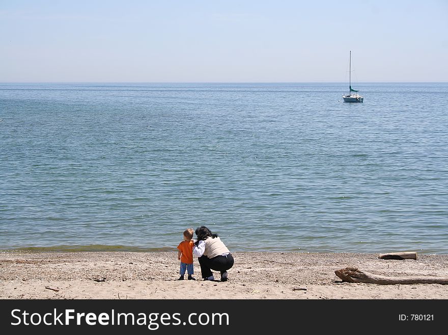 Woman and baby on the beach