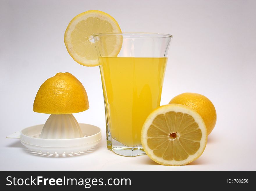 Lemon and lemonade with squeezer in isolated. Lemon and lemonade with squeezer in isolated