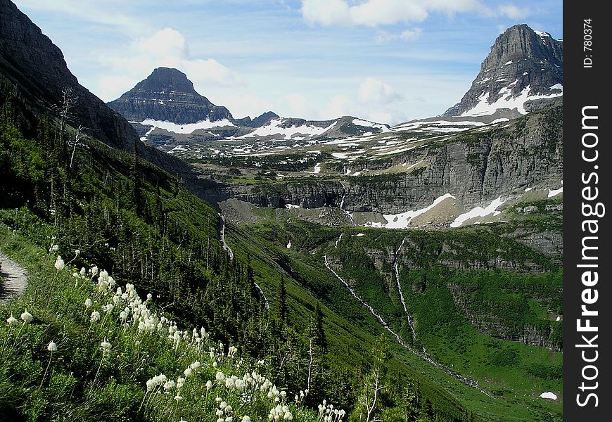 This is a Glacier National Park scene from the Highline Trail during a mid-summer hike. This is a Glacier National Park scene from the Highline Trail during a mid-summer hike.