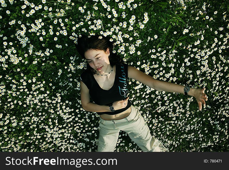 Girl in the flowers defending herself. Girl in the flowers defending herself