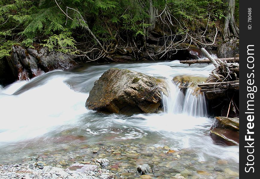 This picture of a small waterfall was taken in Glacier National Park during a spring hike. This picture of a small waterfall was taken in Glacier National Park during a spring hike.