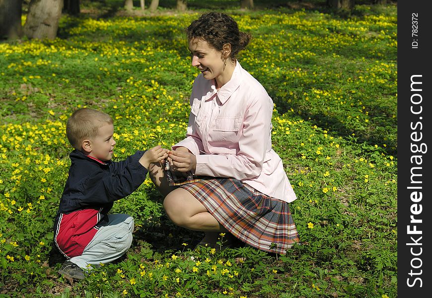 Mother with son in flower meadow
