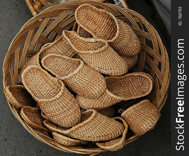 Traditional slippers in a basket