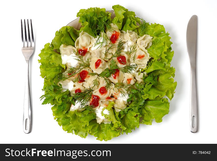 Ravioli With Greens Sour Cream And Ketchup Dish Isolated