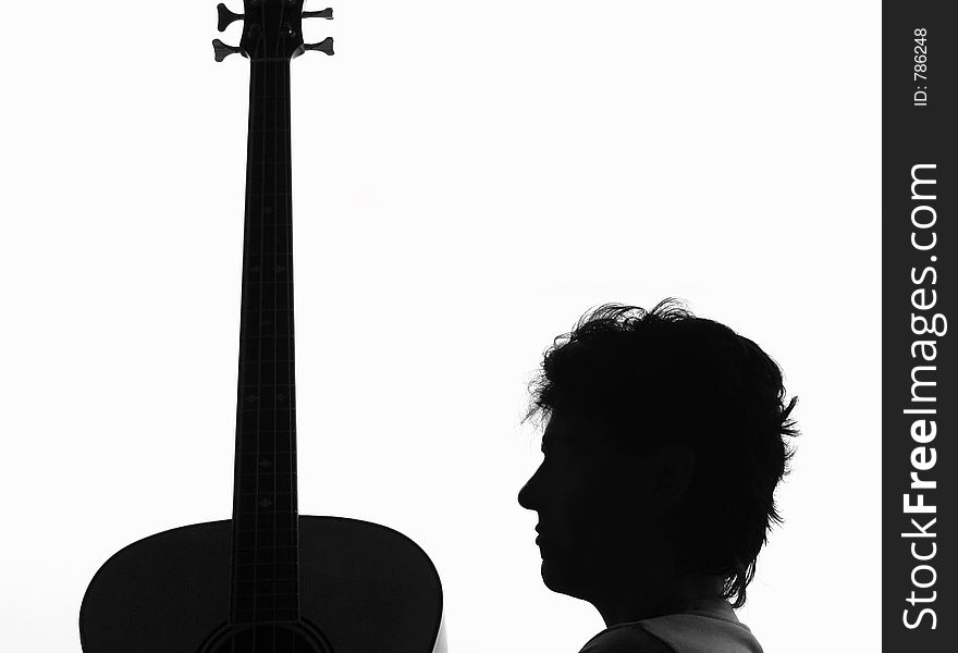 Silhouette from a woman and a guitar. Silhouette from a woman and a guitar