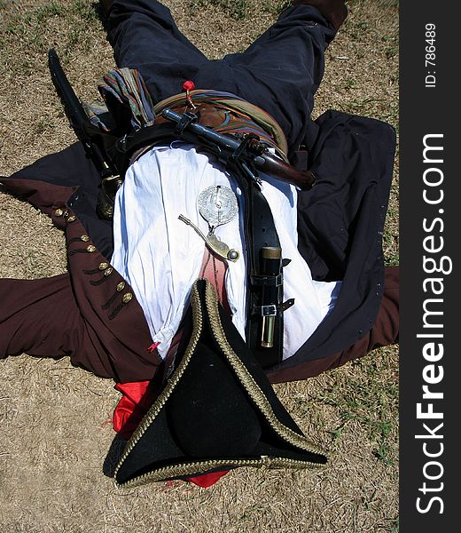 Original image of a pirate sleeping on the ground. Original image of a pirate sleeping on the ground.