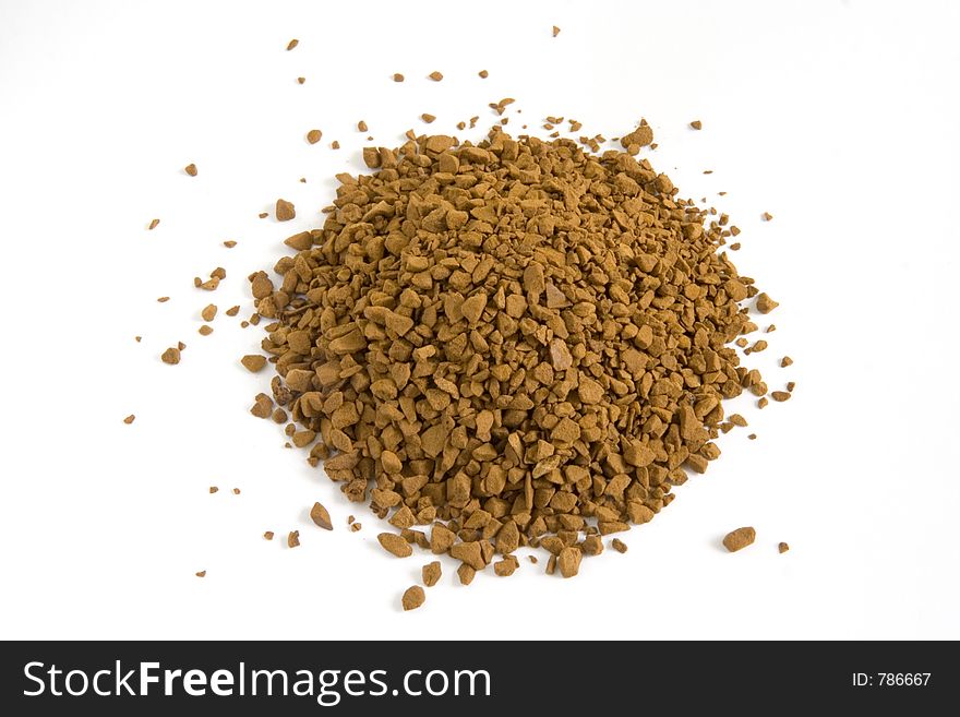 Pile of instant dried coffee grains isolated against white background. Pile of instant dried coffee grains isolated against white background.