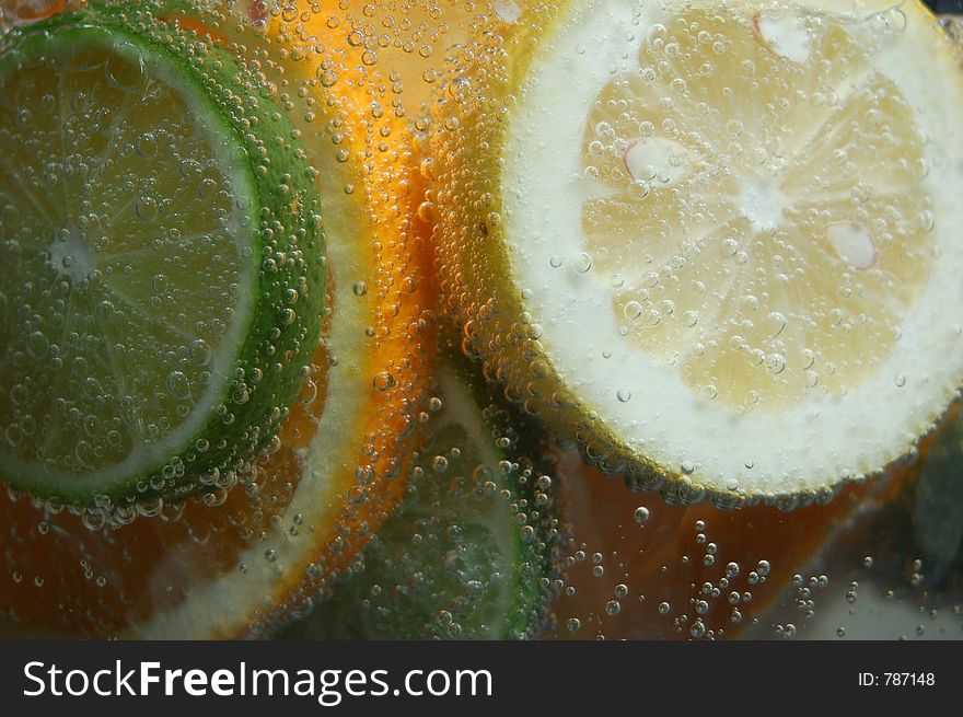 Slices of fruite floating in sprits. Slices of fruite floating in sprits