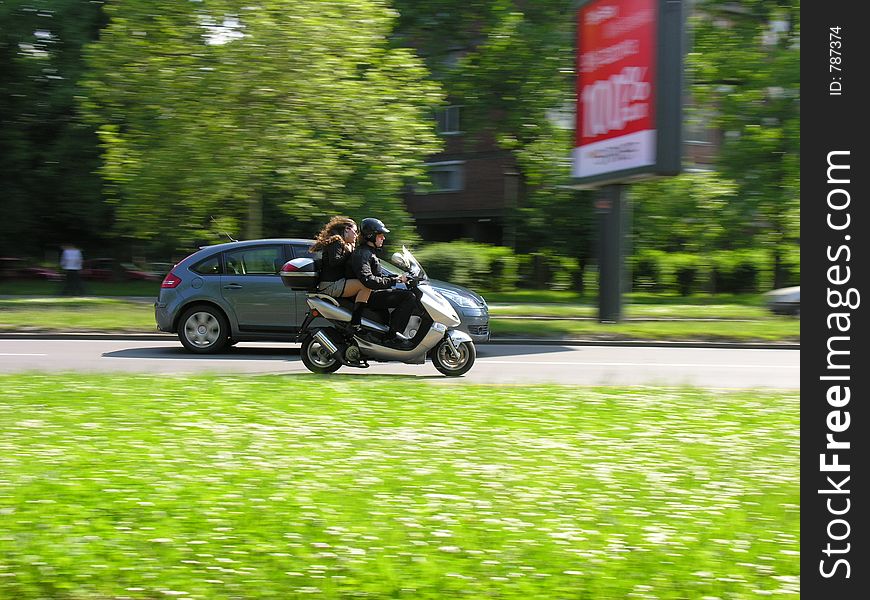 Couple on a scooter bike. Couple on a scooter bike