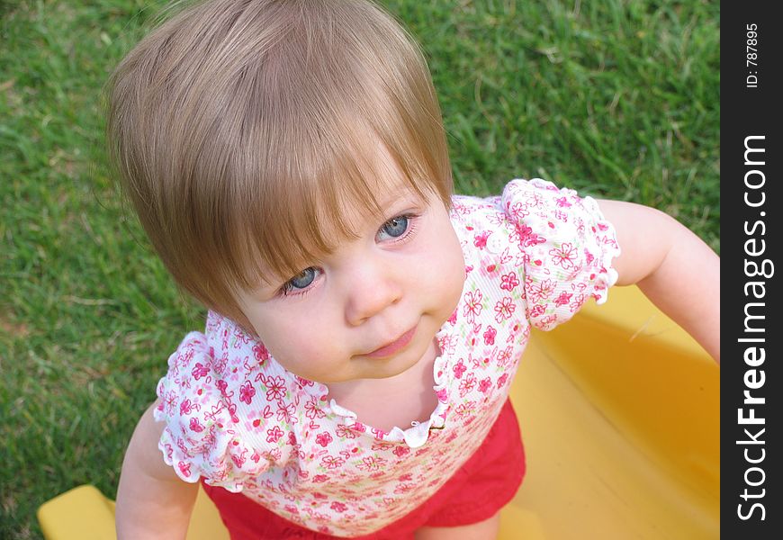 Baby playing on slide