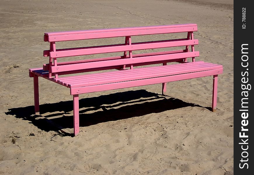 Pink wooden bench.