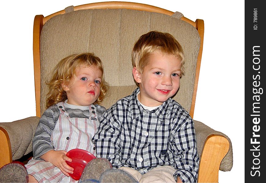 Two kids on a rocking chair. Two kids on a rocking chair