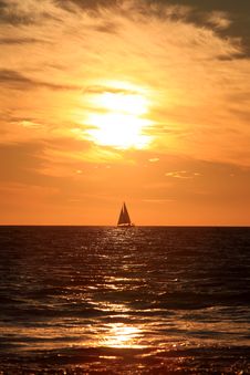 Sunset And Sailing Ship Stock Photography