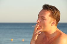 A Young Man Smoking Stock Photography