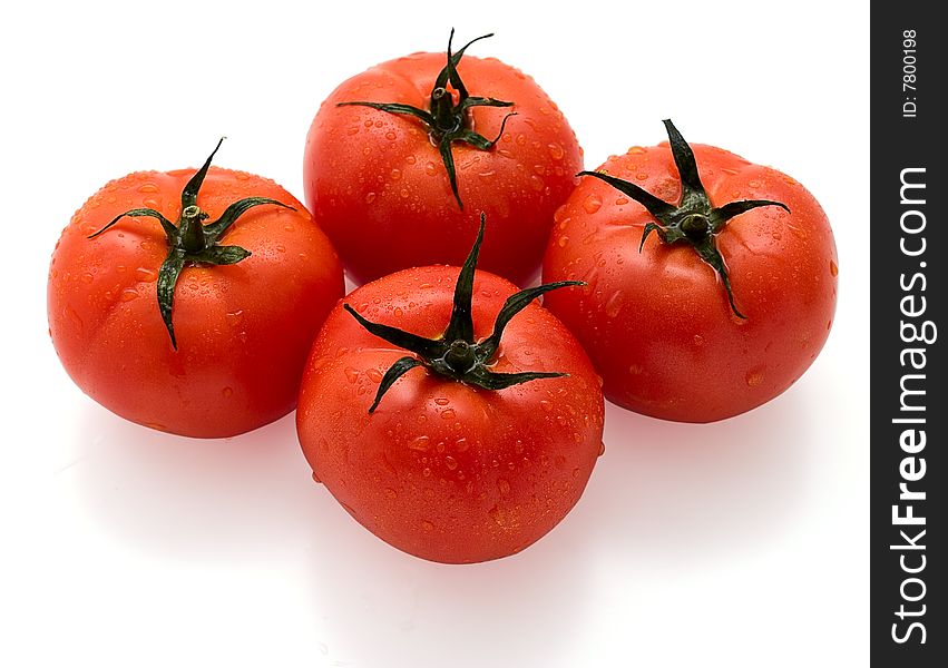 Red tomatoes isolated on white background. Studio light.