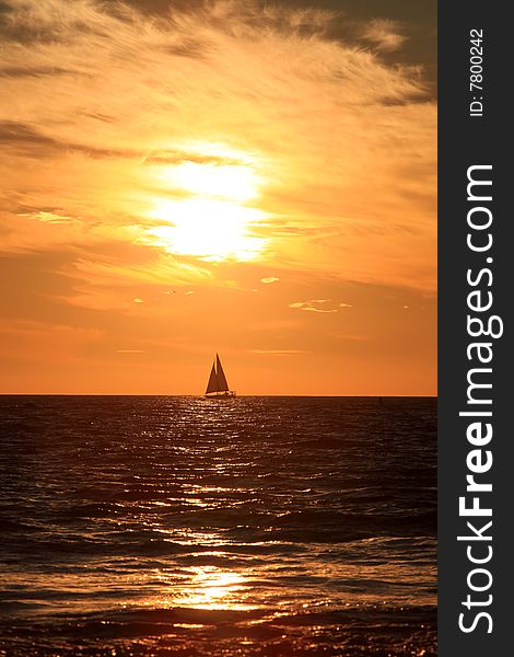 Sunset and sailing ship in Santa Mornica beach