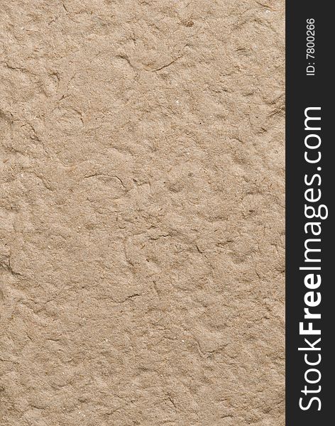 Recycled brown fiber cardboard for use as background texture. Recycled brown fiber cardboard for use as background texture