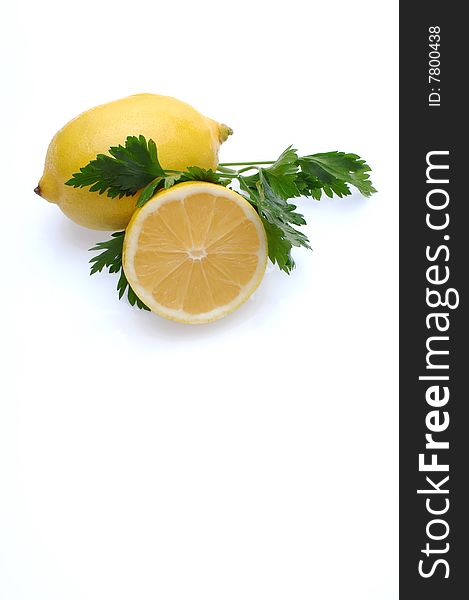 Lemon and parsley isolated at white