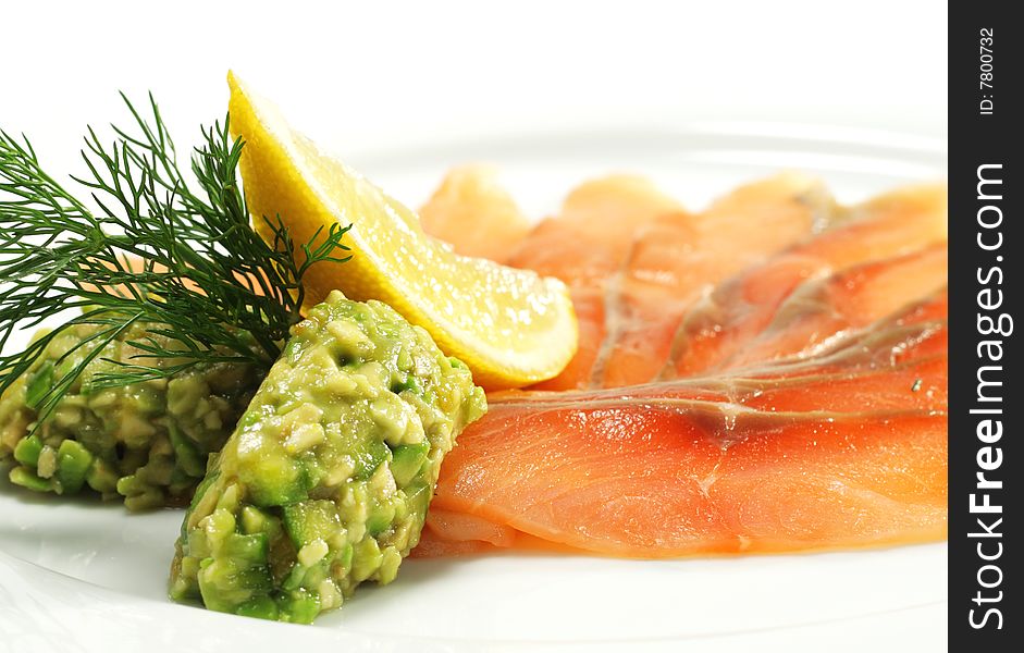 Soft Salt Salmon with Avocado Frappe and Lemon Slice. Isolated on White Background