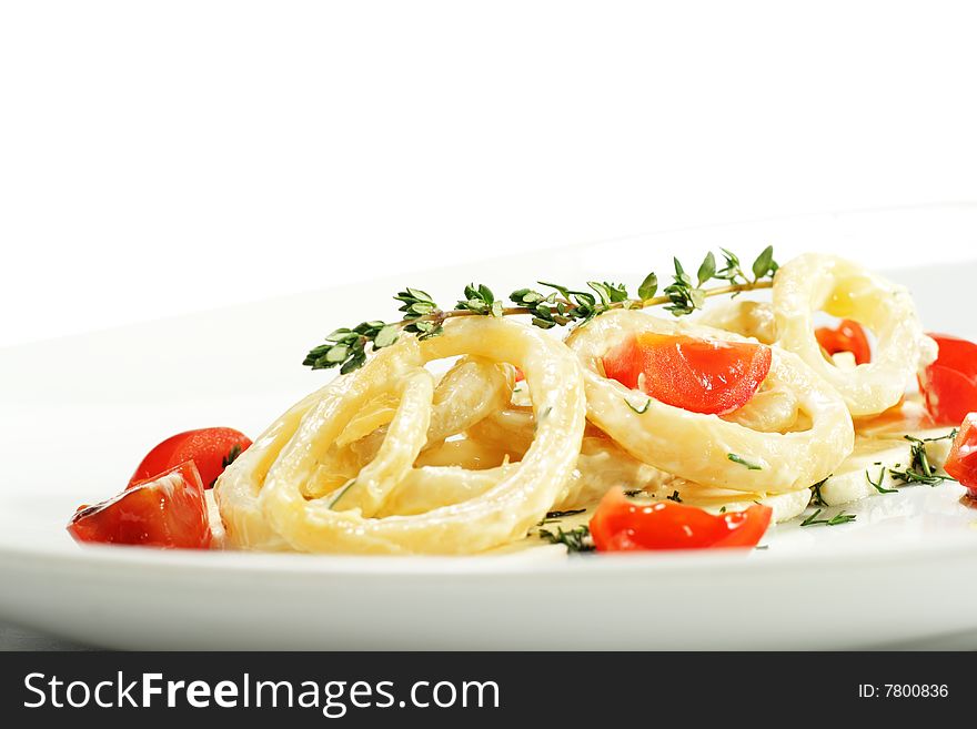 Salad with Calamari Rings, Sheep Cheese and Tomato. Isolated on White Background. Salad with Calamari Rings, Sheep Cheese and Tomato. Isolated on White Background