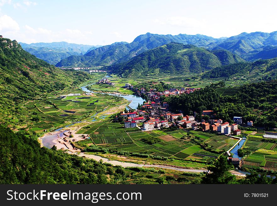 The village is in spring with the fields  & the river. The village is in spring with the fields  & the river