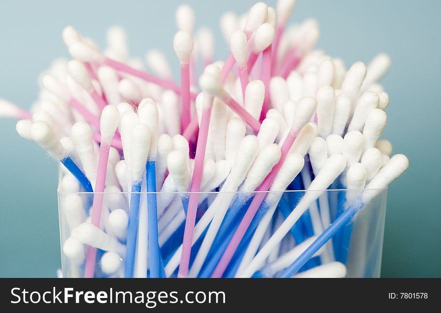 Cotton sticks isolated on a blue background