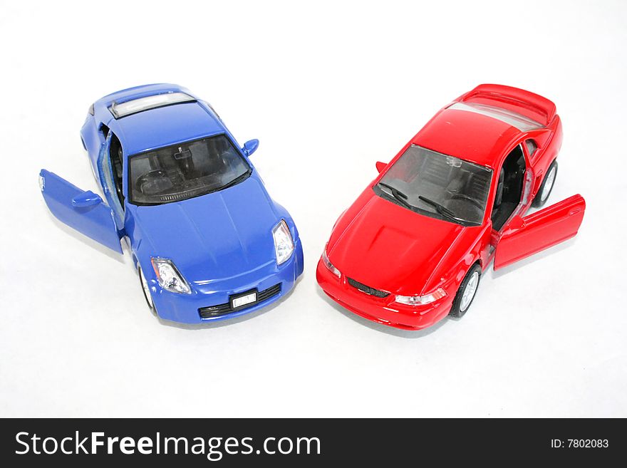 The two toy red and blue machine on a white background. The two toy red and blue machine on a white background