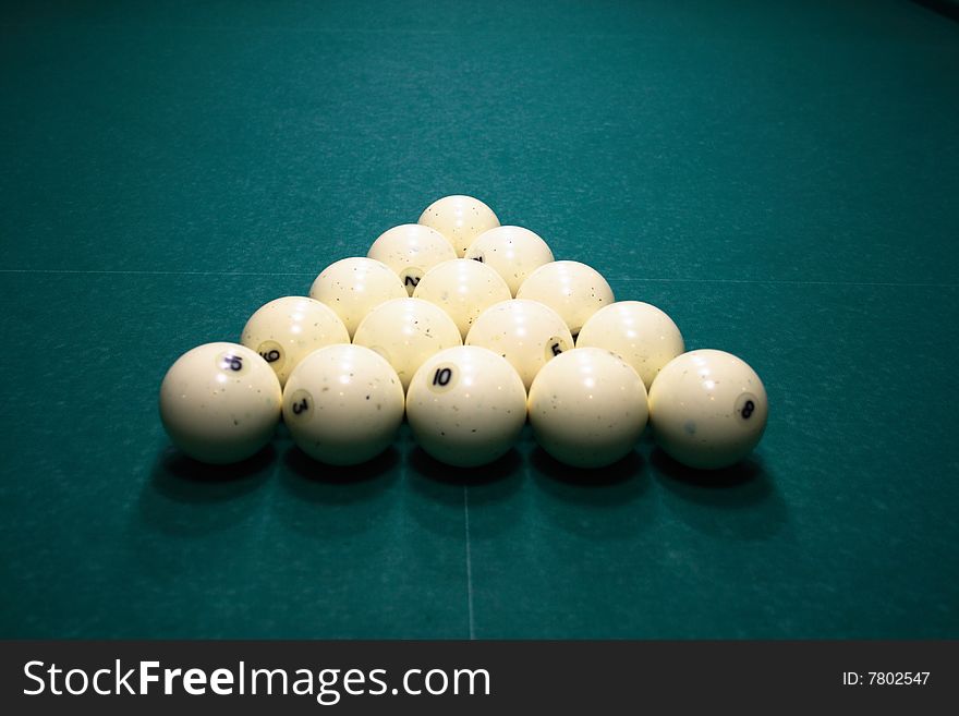 Pool balls on green pool table