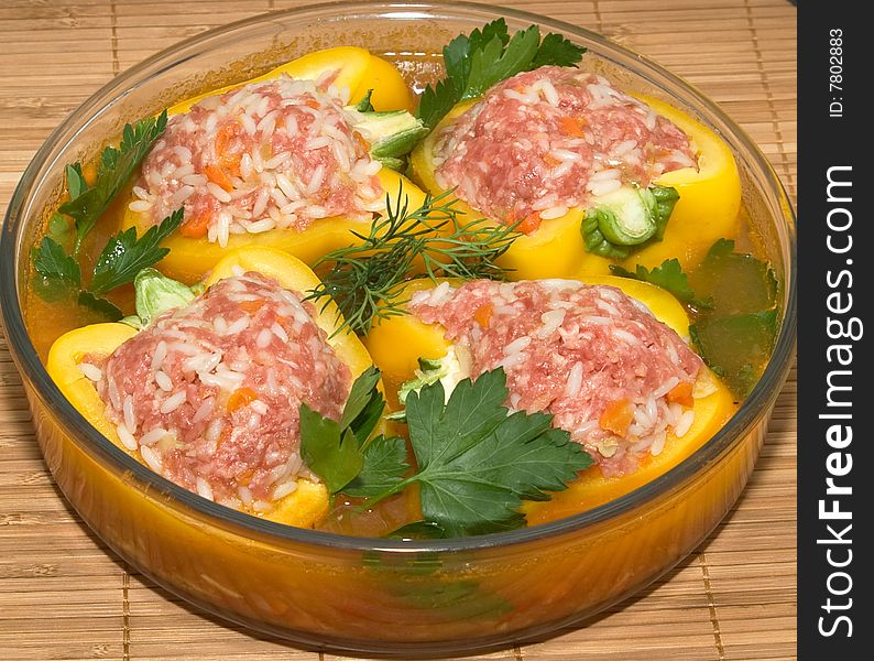 Stuffed peppers on a dish with parsley