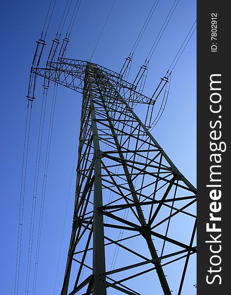 Electrical pylon with blue sky background. Electrical pylon with blue sky background