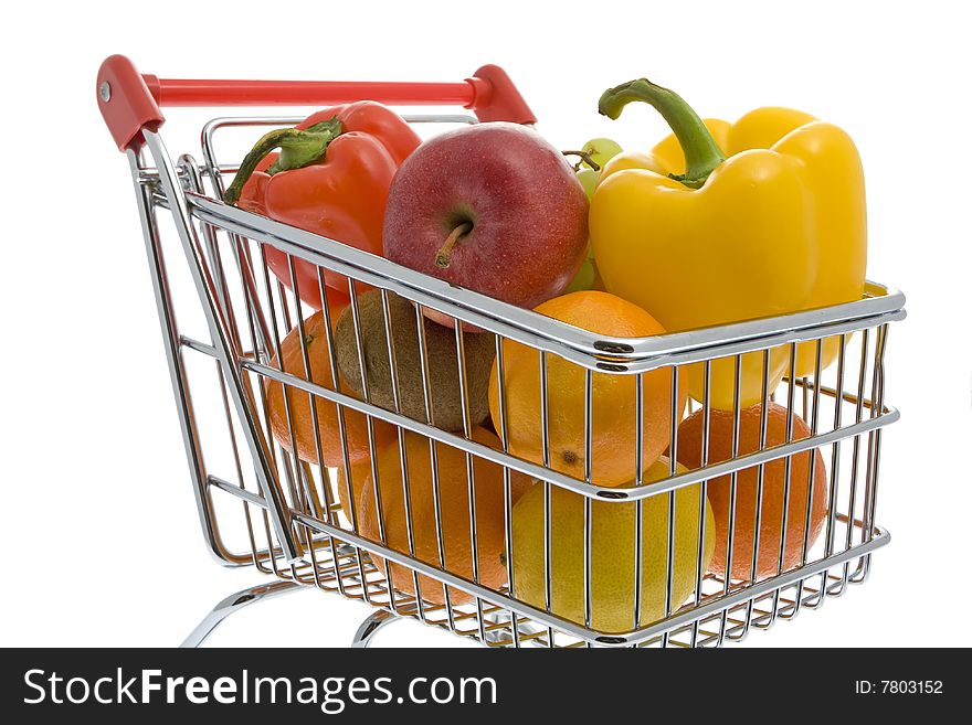 Shopping trolley with fruits and vegetables against a white background