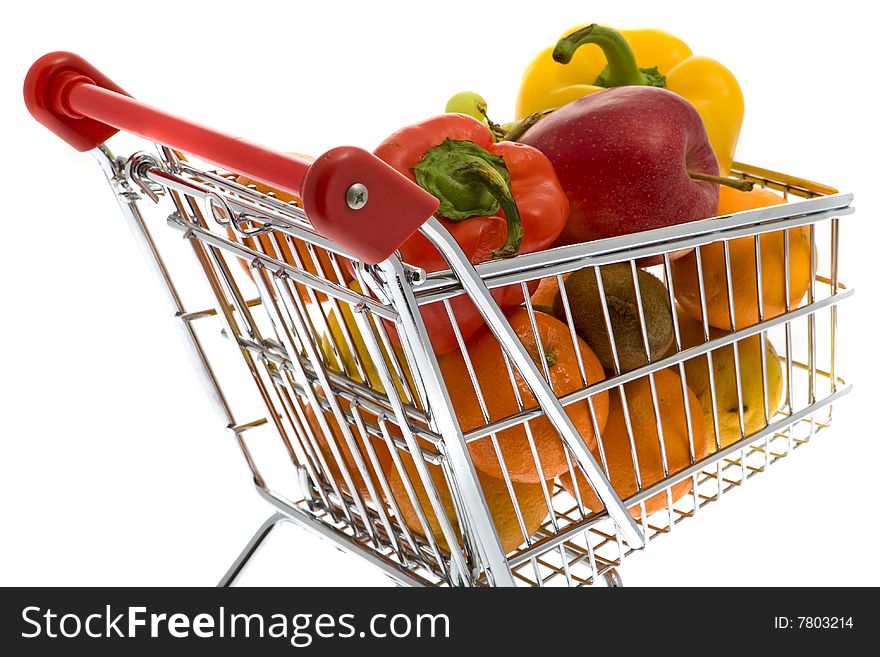 Shopping trolley with fruits and vegetables against a white background