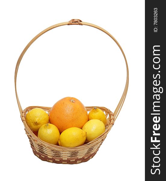 Basket wth grapefruit and lemons isolated on a white background .