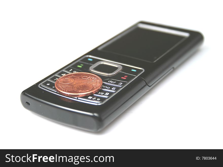 Moder mobile phone and coin. Isolated on white background.