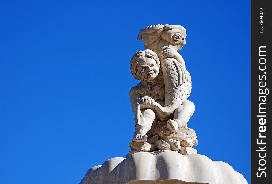 The angle of the setting sun highlights the detail of this vintage statue fountain. The azure sky makes for a simply profound backdrop. The angle of the setting sun highlights the detail of this vintage statue fountain. The azure sky makes for a simply profound backdrop.