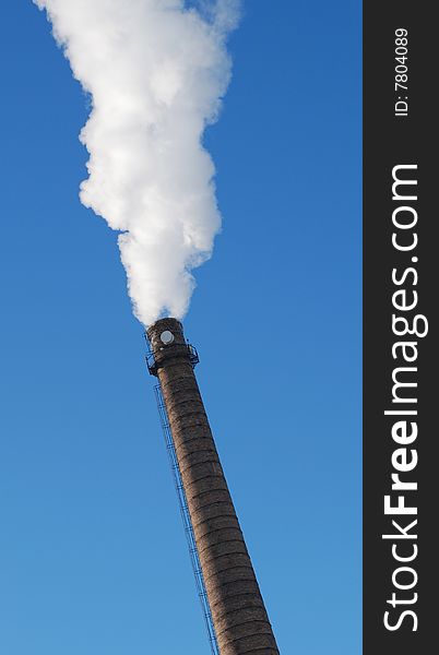 The boiler-house works. Pairs from a pipe in frosty day. The boiler-house works. Pairs from a pipe in frosty day