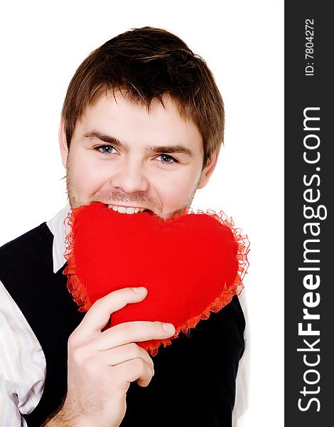 Stock photo: an image of a man biting a red heart. Stock photo: an image of a man biting a red heart