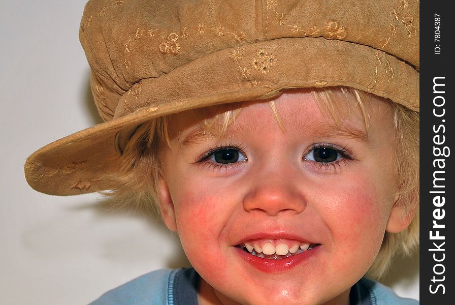 Two year old posing with grandmas hat. Two year old posing with grandmas hat