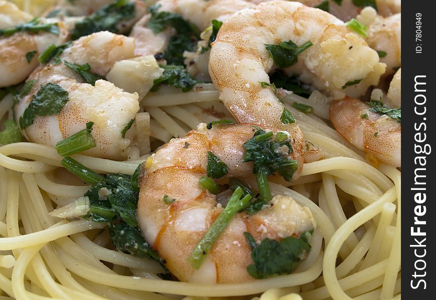 Closeup of spaghetti with fried shrimps and parsley. Closeup of spaghetti with fried shrimps and parsley