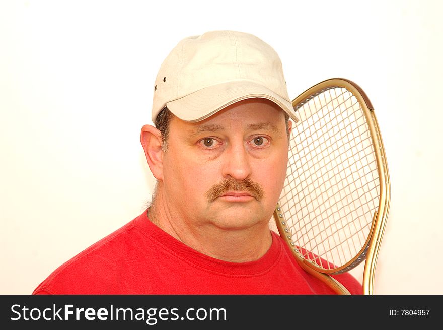 Man ready for a game of tennis with friends. Man ready for a game of tennis with friends.