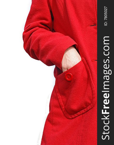 A woman's hand in s red coats pocket. A woman's hand in s red coats pocket