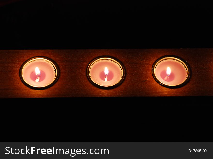 Candles row in a winter frozen night. Candles row in a winter frozen night.