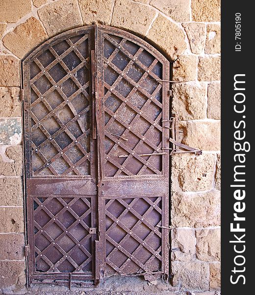 Old antique handmade Oriental Arabic style metal iron door. Old antique handmade Oriental Arabic style metal iron door