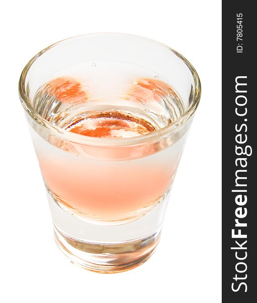 Orange alcohol drink shot from top, isolated