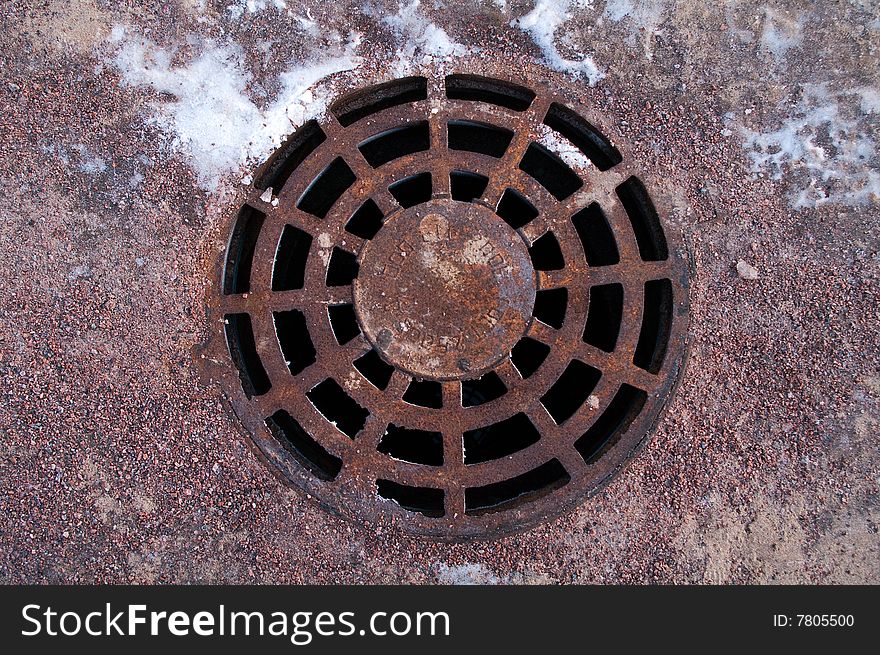 Cast iron manhole cover for background and texture