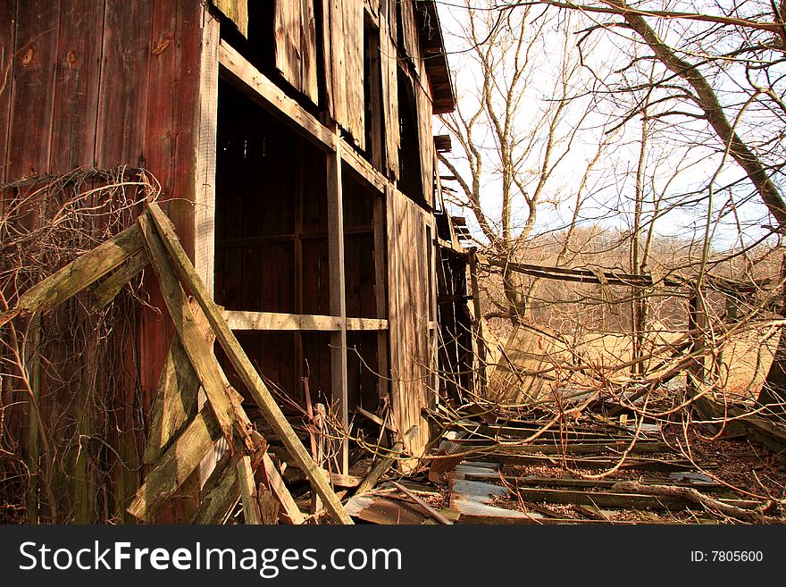 Old wooden home abandoned in the grasslands close up